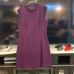 Plum tahari dress with black gems on the collar and sleeves